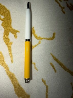 Coach Yellow and White Pen